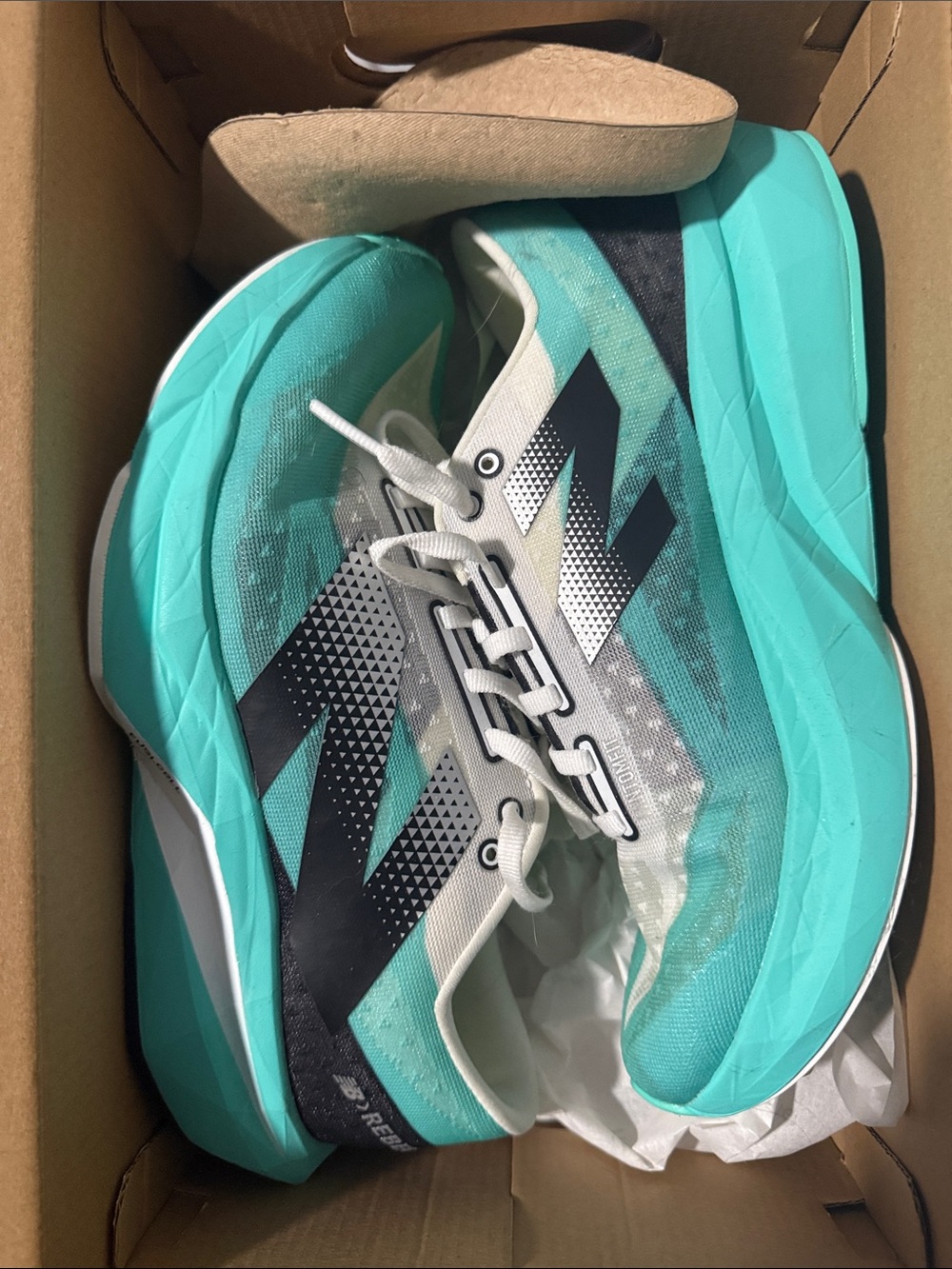 New Balance Women's Teal and Black rebel v4 9wide